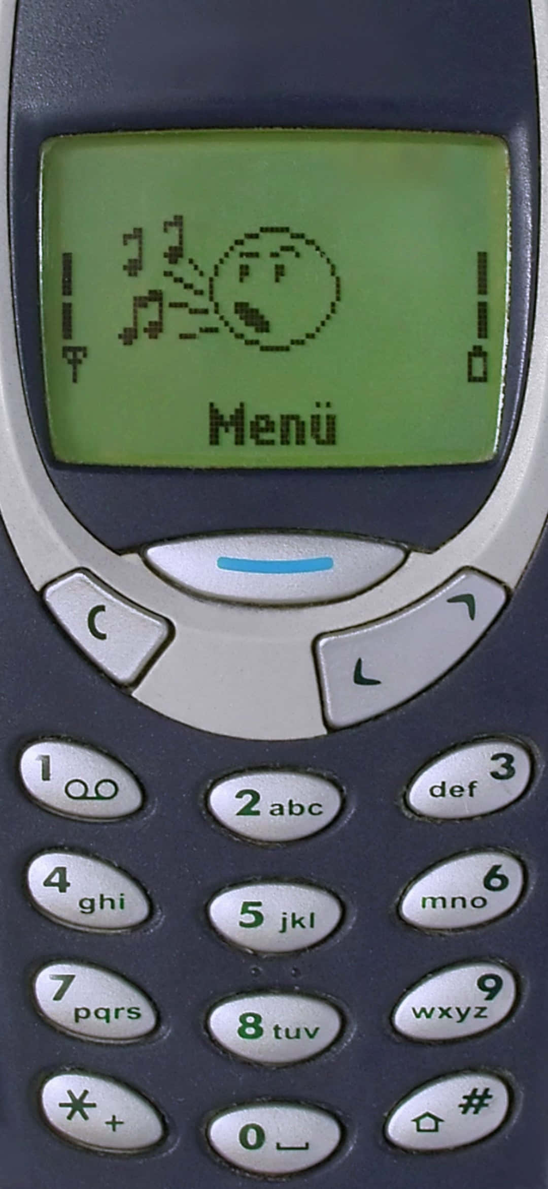 Nokia 桌布 壁紙 — 復古手機特寫，綠色屏幕上顯示像素化的憤怒表情和音符。