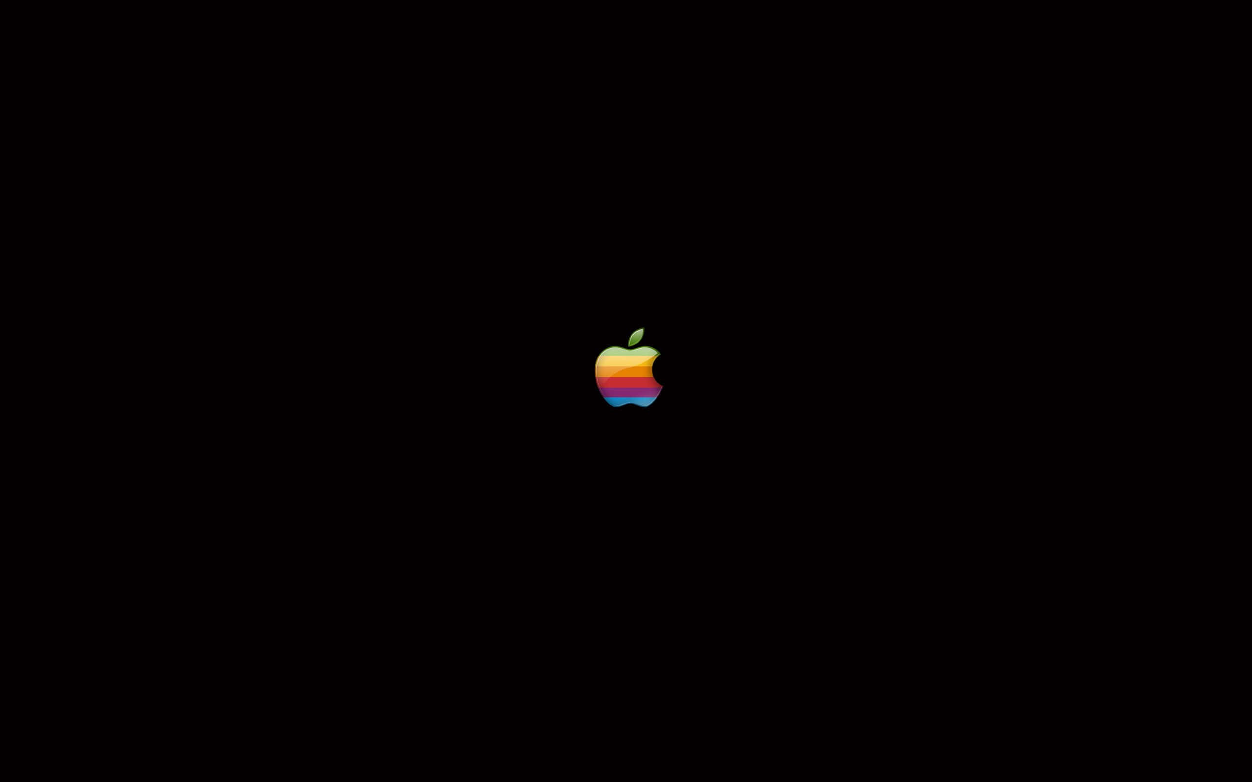 復古蘋果標誌 壁紙 — 一個復古彩虹Apple標誌居中在純黑色背景上。
