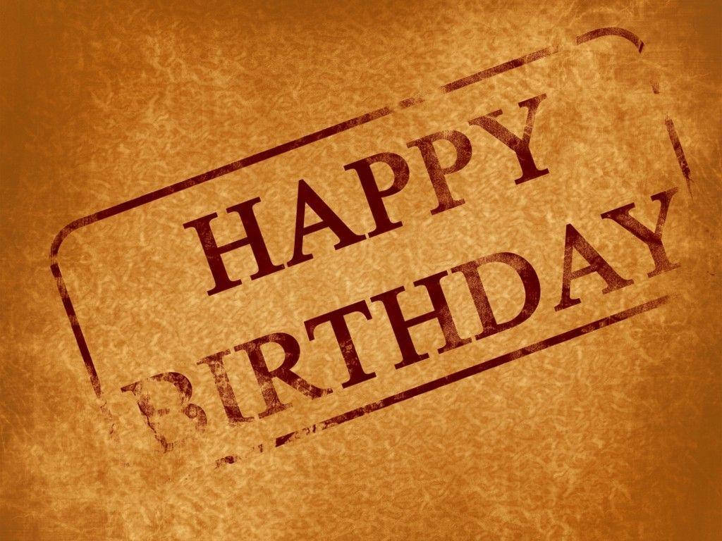 Happy Birthday 用紅色墨水印在紋理棕色紙上。