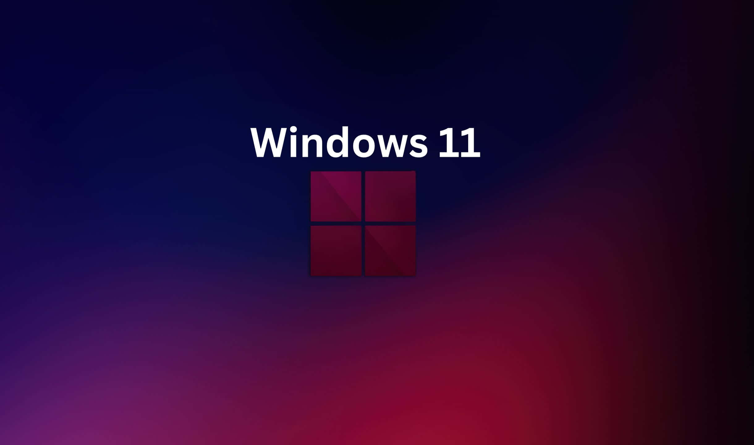 Windows 11 標誌在藍色到紅色的漸變背景上。