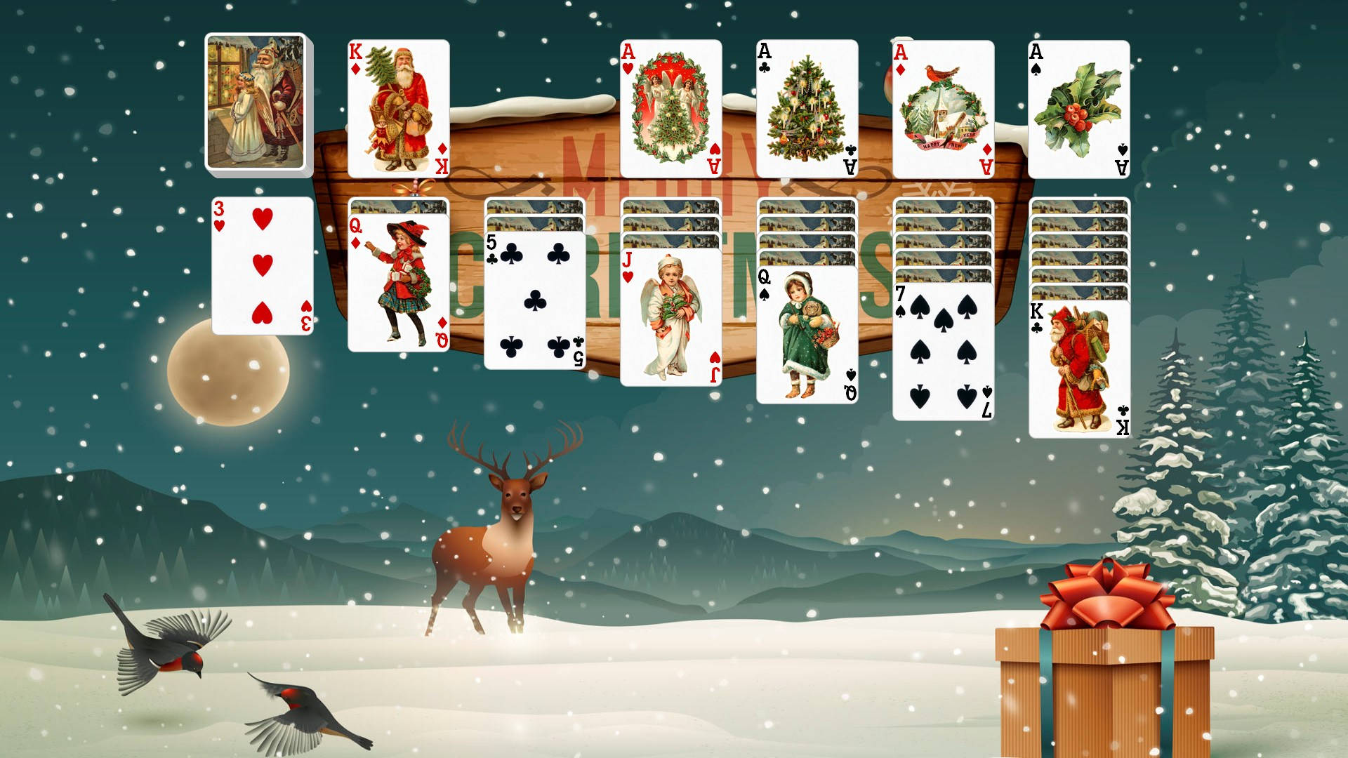 聖誕接龍遊戲，有卡牌、鹿、鳥和禮物，在雪夜場景中。