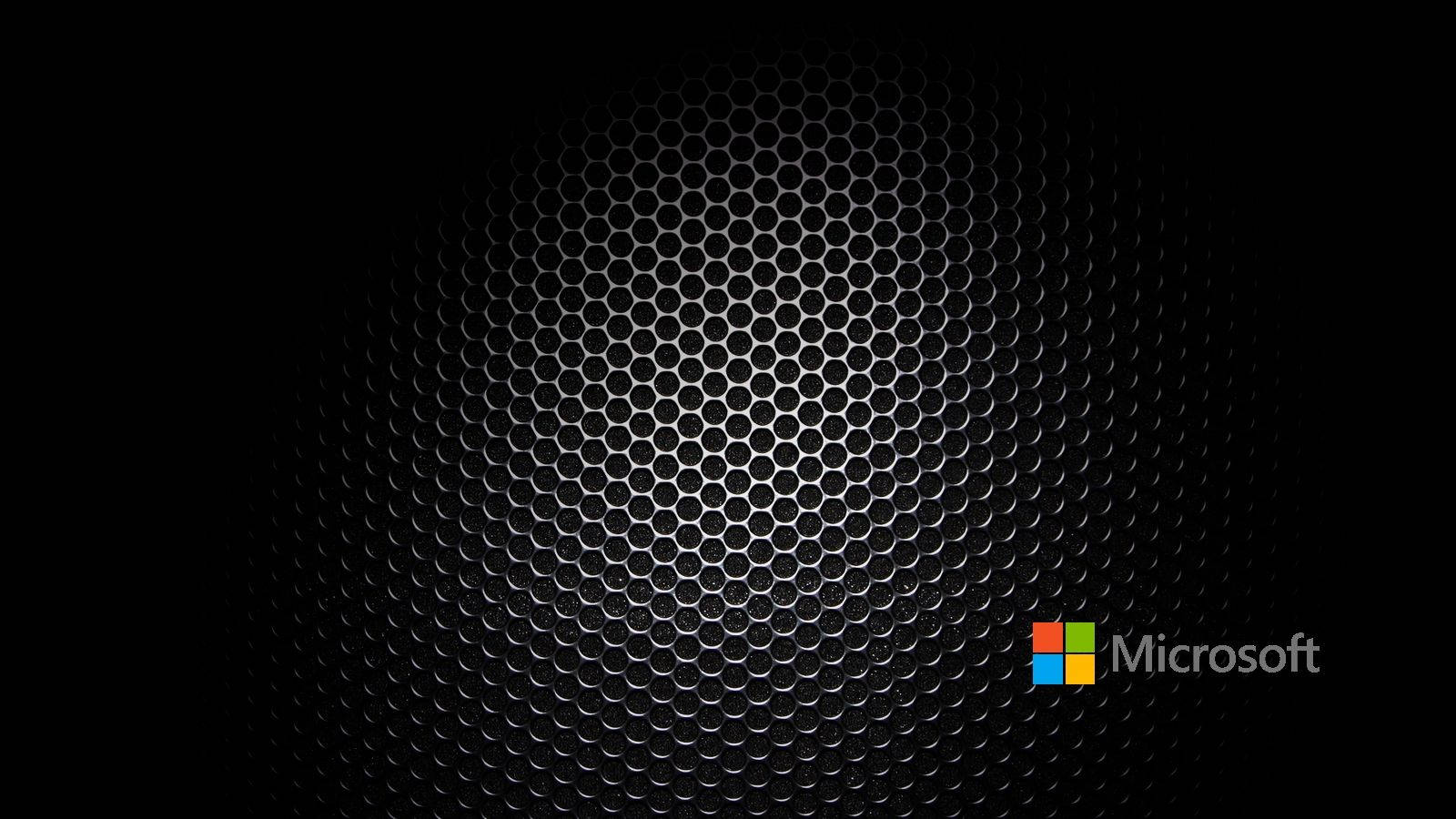帶有Microsoft標誌的深色金屬六角形網格