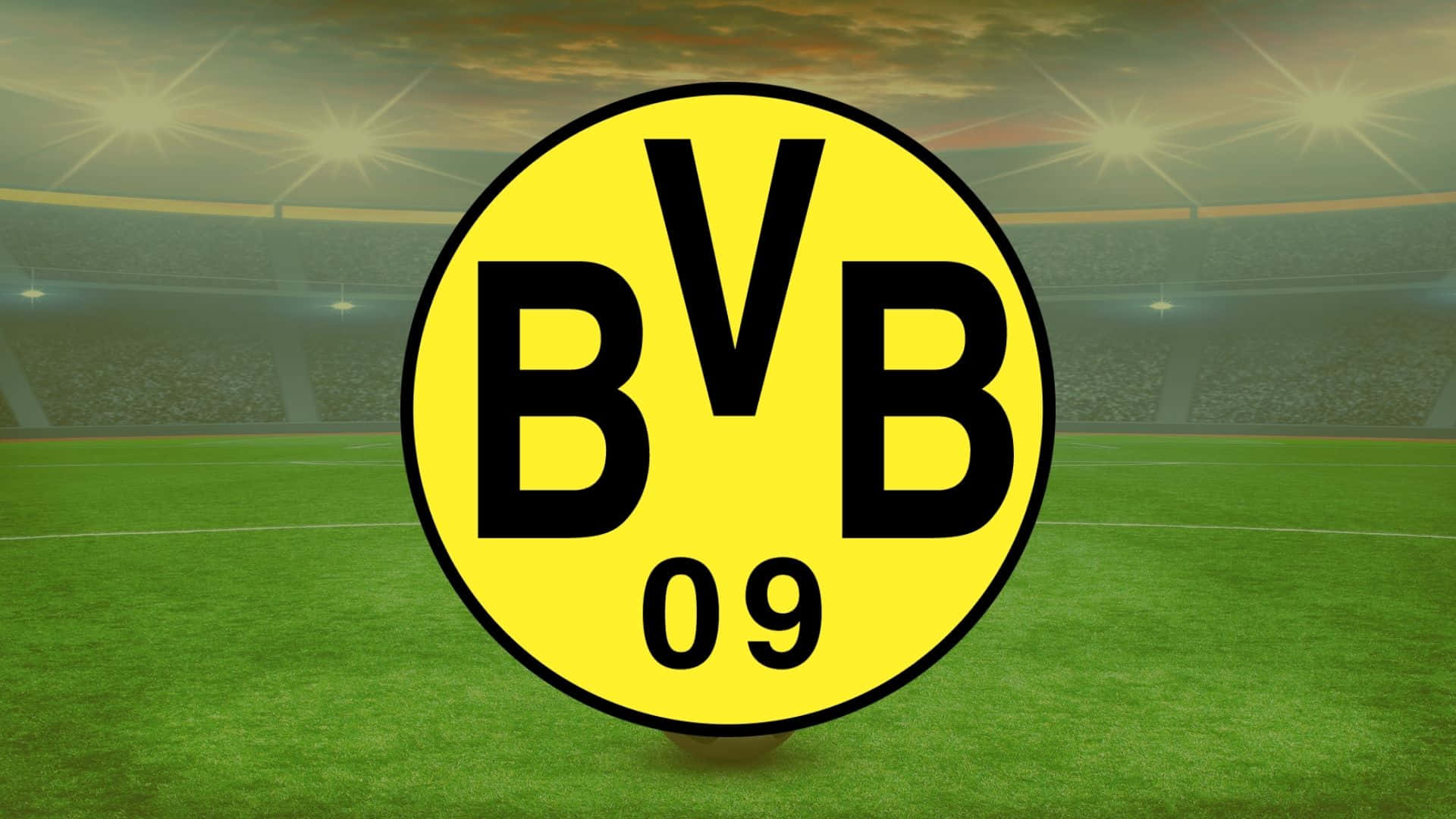 暮色中體育場燈光下的綠色球場上BVB 09足球會標誌。