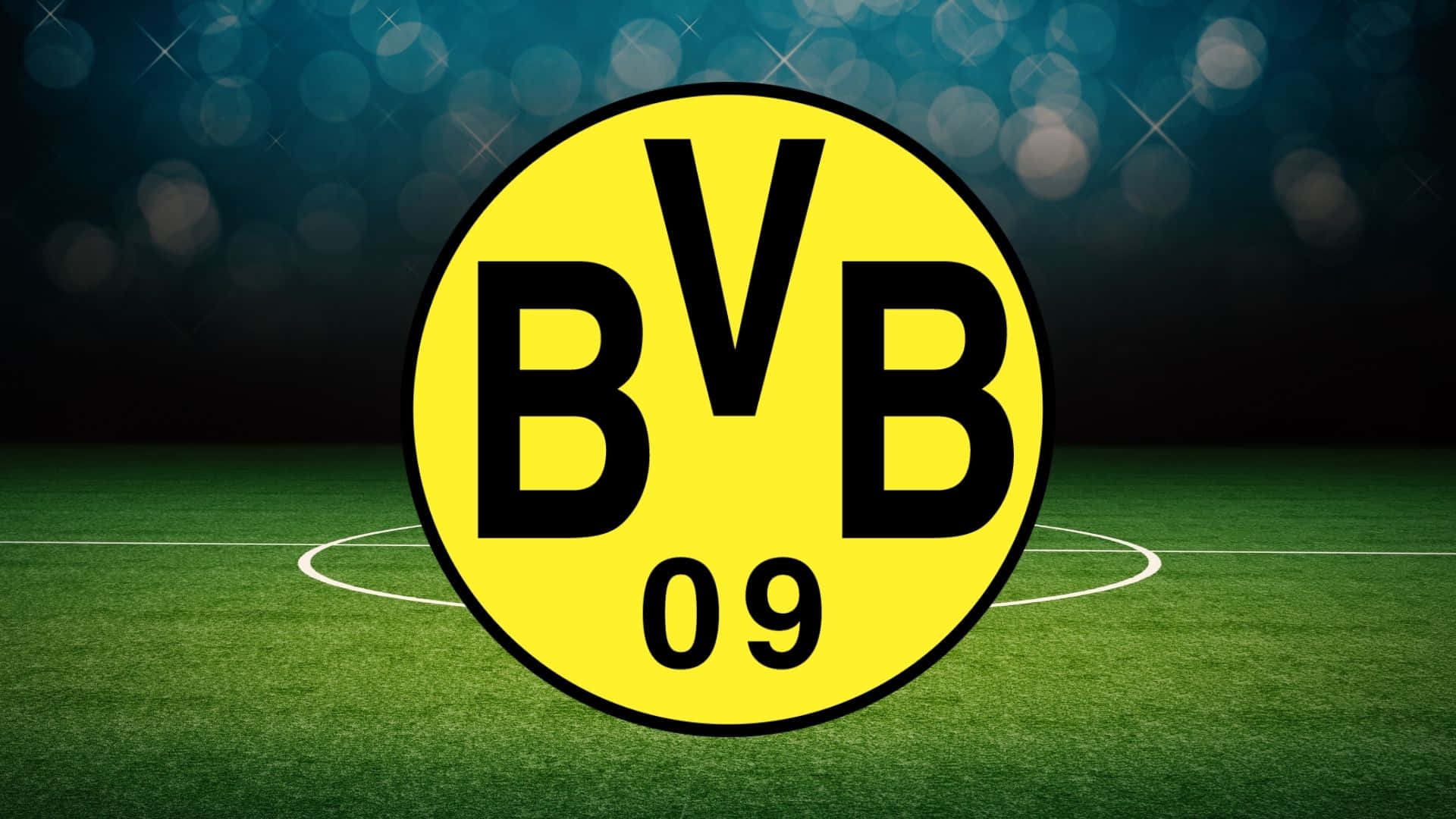 BVB 09 足球會標誌在夜間體育場燈光下的綠色球場上。