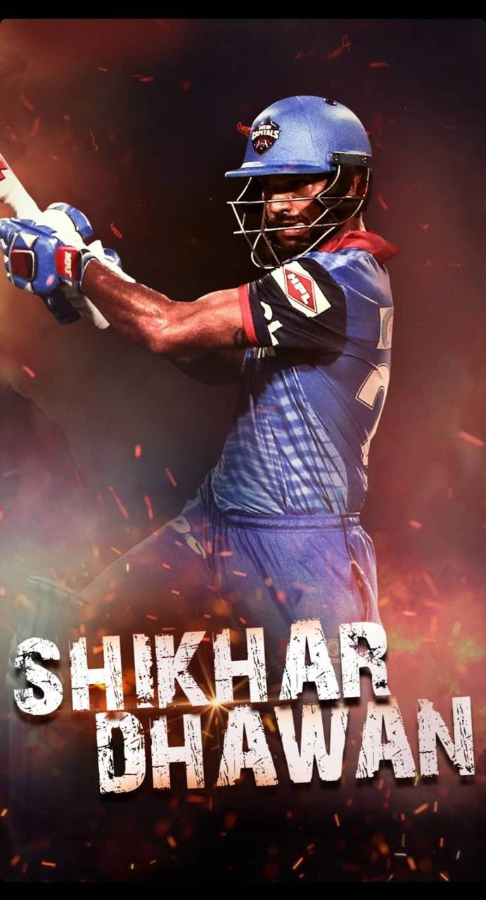 板球運動員 Shikhar Dhawan 揮動球棒，火花四濺。