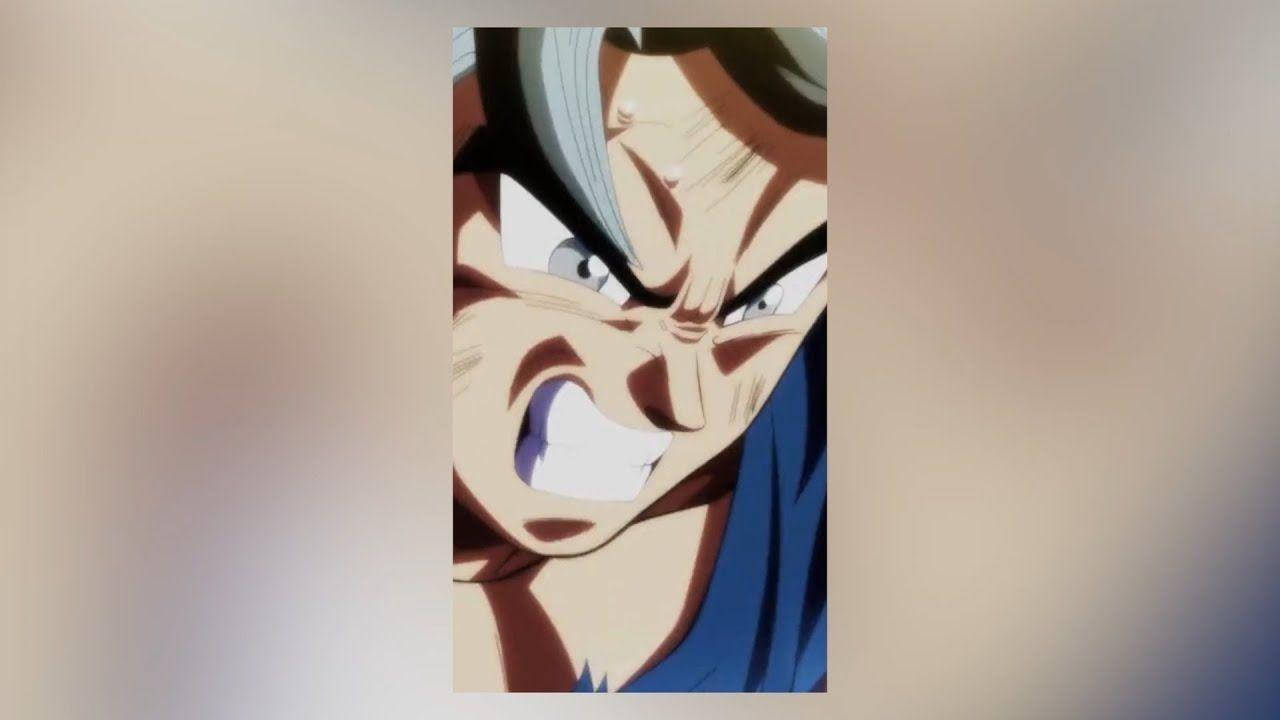 怒氣爆棚的超級直覺悟空 壁紙 — 一個銀色頭髮、眼神銳利的動漫角色，咬緊牙關、皺著眉頭，兇猛地咆哮。