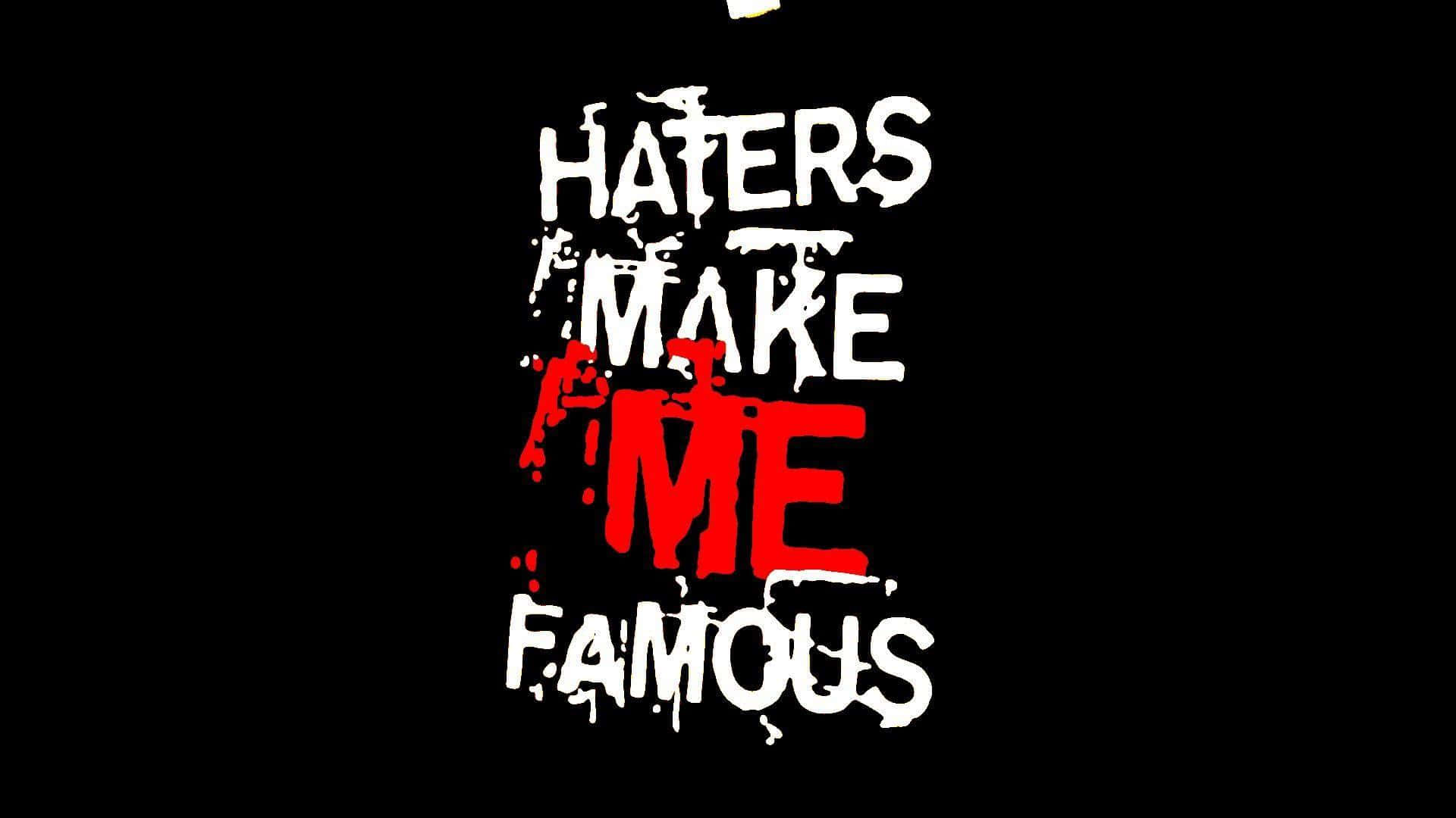 塗鴉文字，黑底紅白字寫著 'Haters Make Me Famous'。