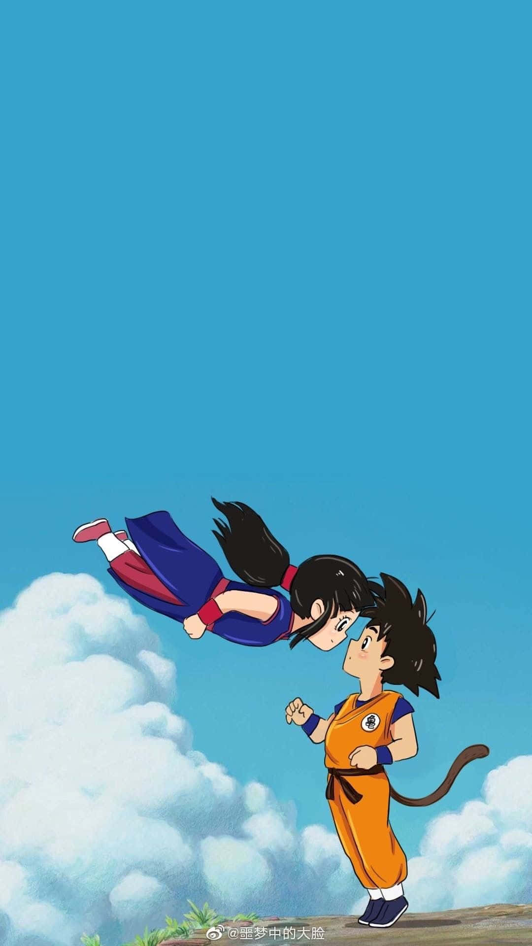 動漫角色悟空和布瑪在藍天下飛翔並站在懸崖上。