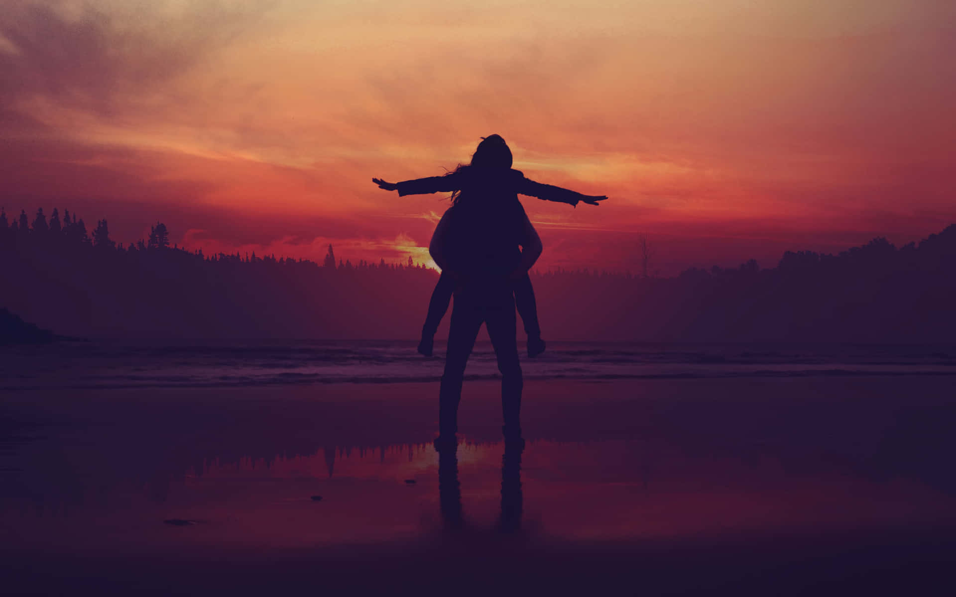 海灘上夕陽下的剪影情侶，天空倒映色彩鮮豔