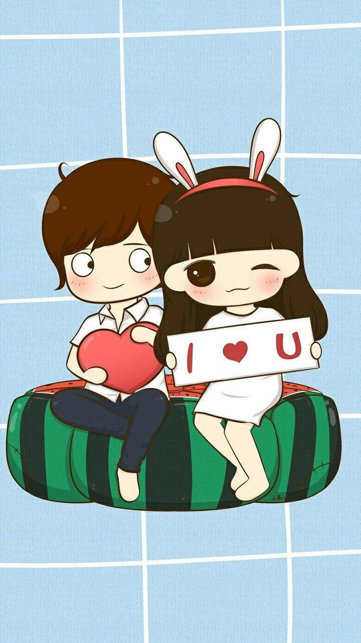 可愛動漫情侶在條紋豆袋椅上拿著心形和I love U標誌。