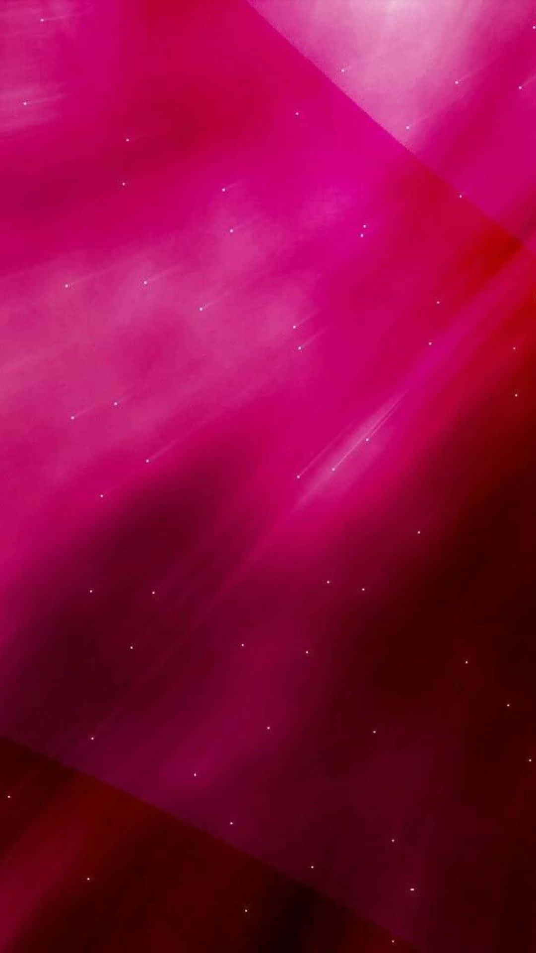 愛與熱情燃起 壁紙 — 充滿活力的洋紅色宇宙射線劃過發光的星雲，散佈著星狀粒子。