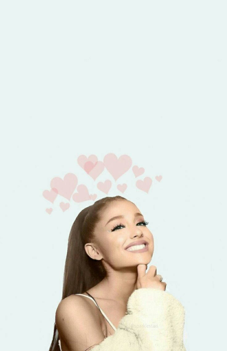 Ariana Grande 微笑，頭頂漂浮住粉紅色心形。