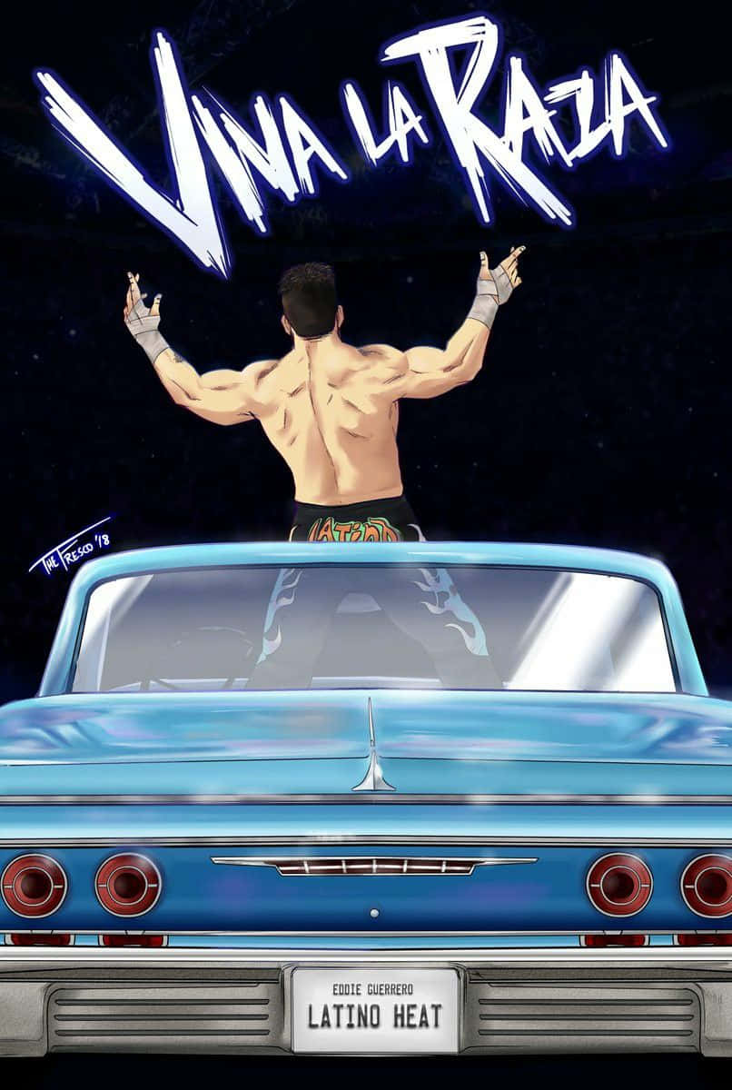 摔角手在藍色汽車上於「Viva La Raza」下舉臂，夜晚。