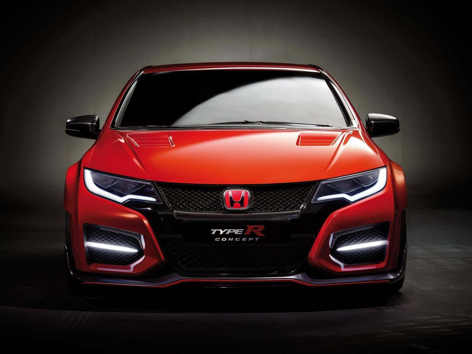 紅色本田 Type R 概念車，在工作室環境中頭燈亮起。