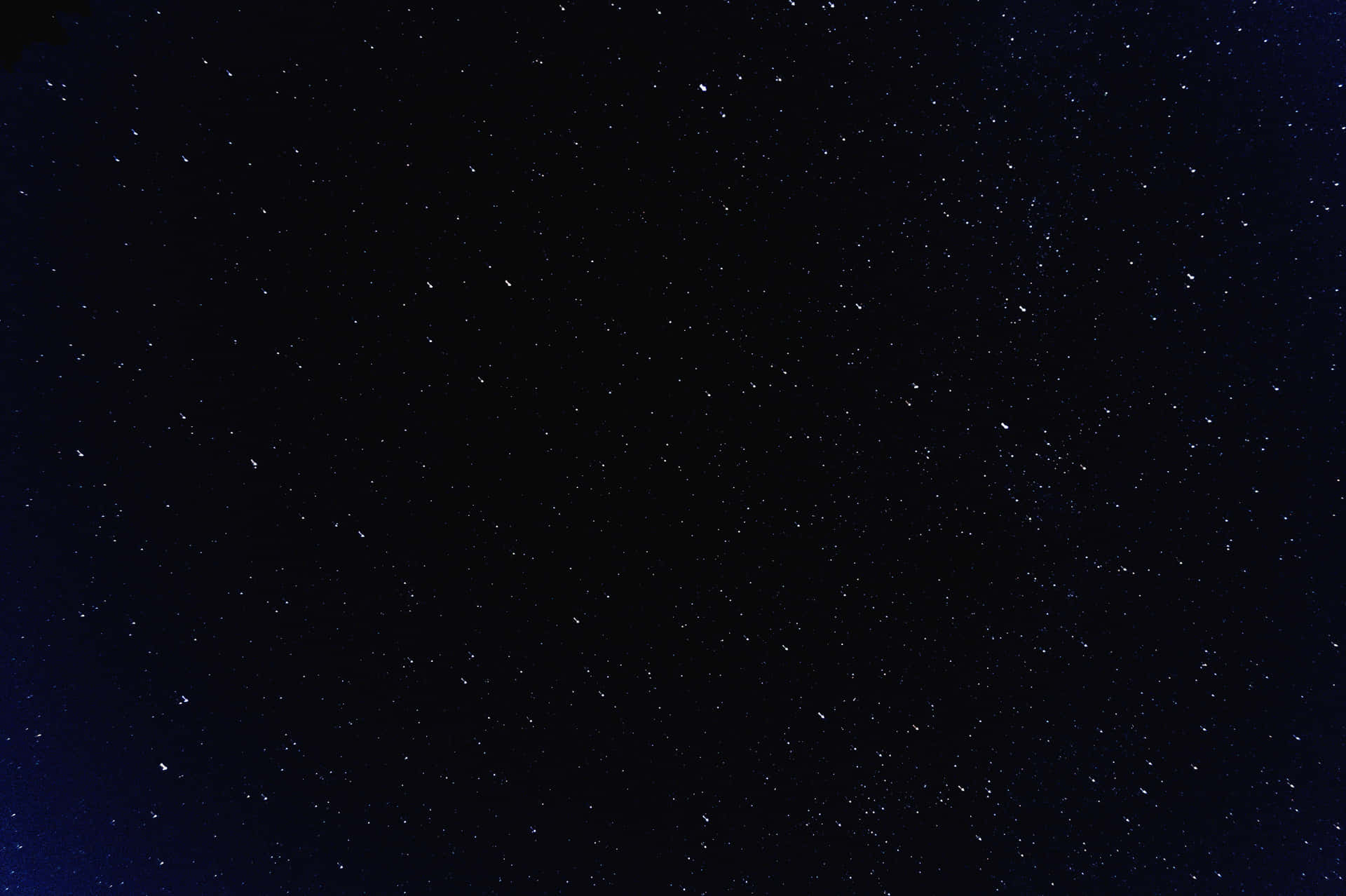 深藍色背景上，無數星星點綴的星空。