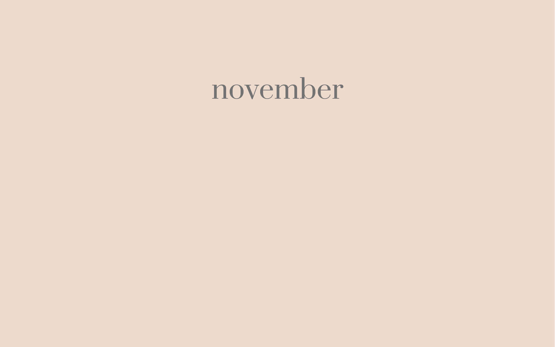 簡約米色牆紙，中央有灰色文字寫著 november。