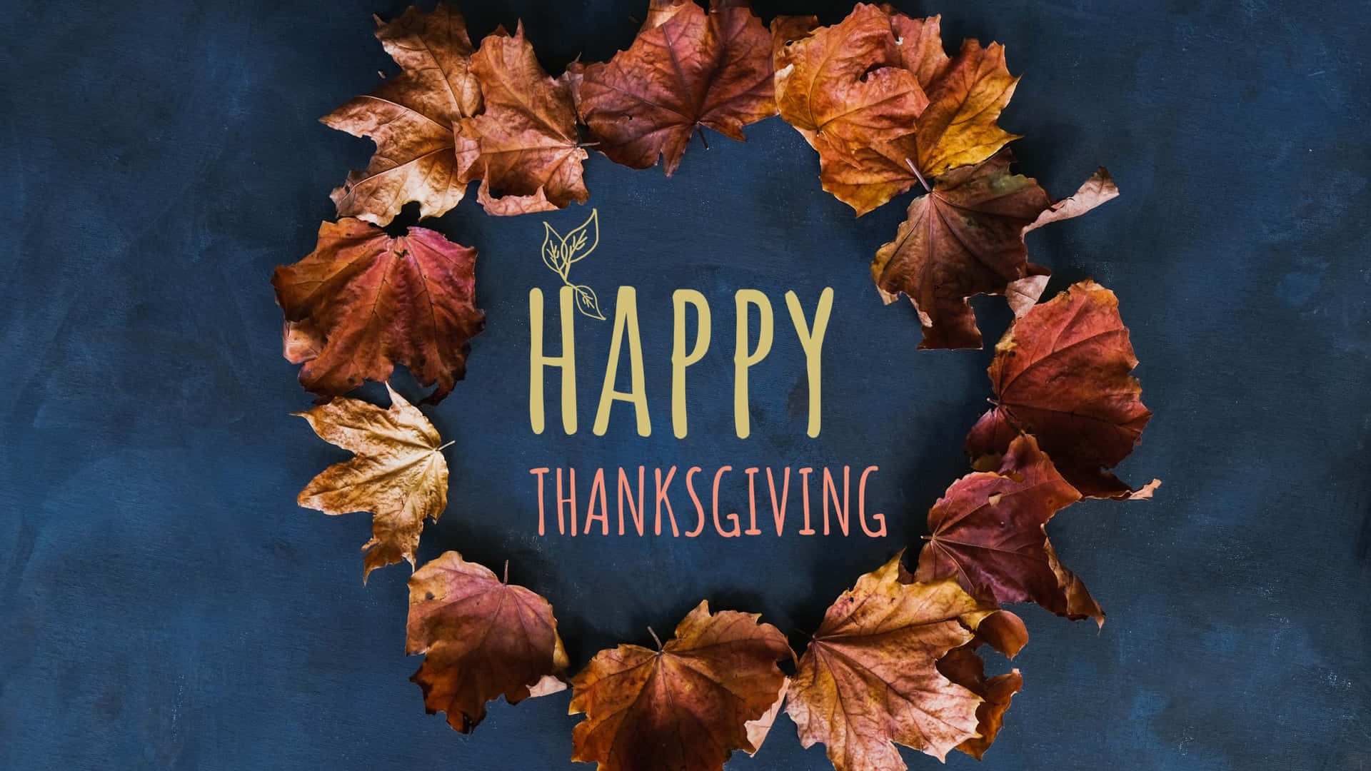 深藍色背景上帶有「Happy Thanksgiving」文字的秋葉花環。
