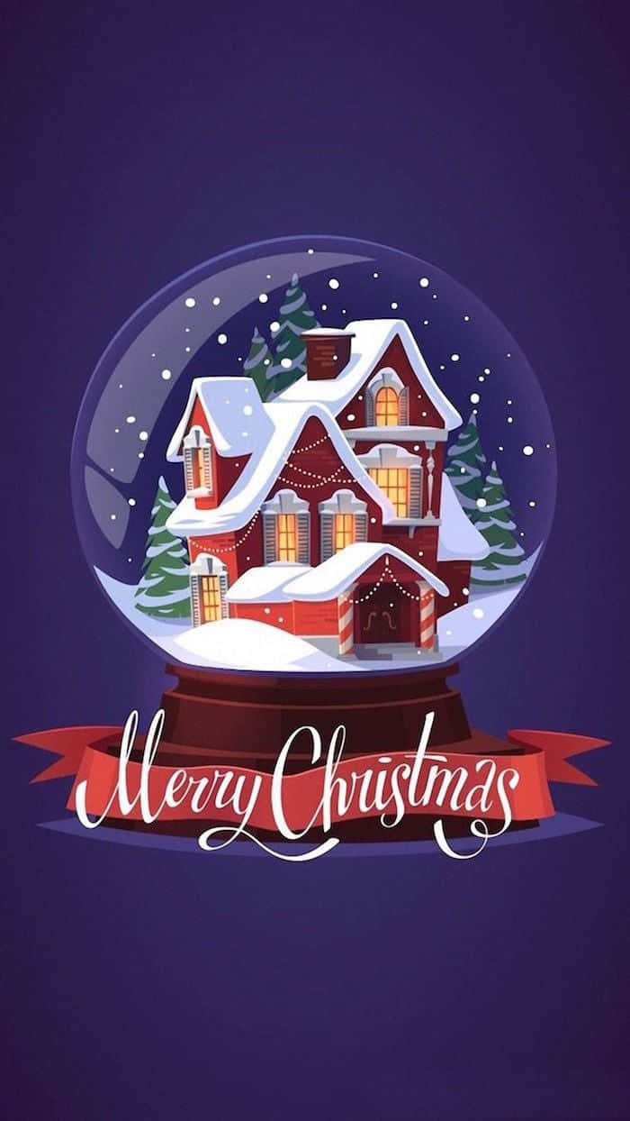 雪球內有紅色房子和雪下的樹木，並有「Merry Christmas」橫幅。