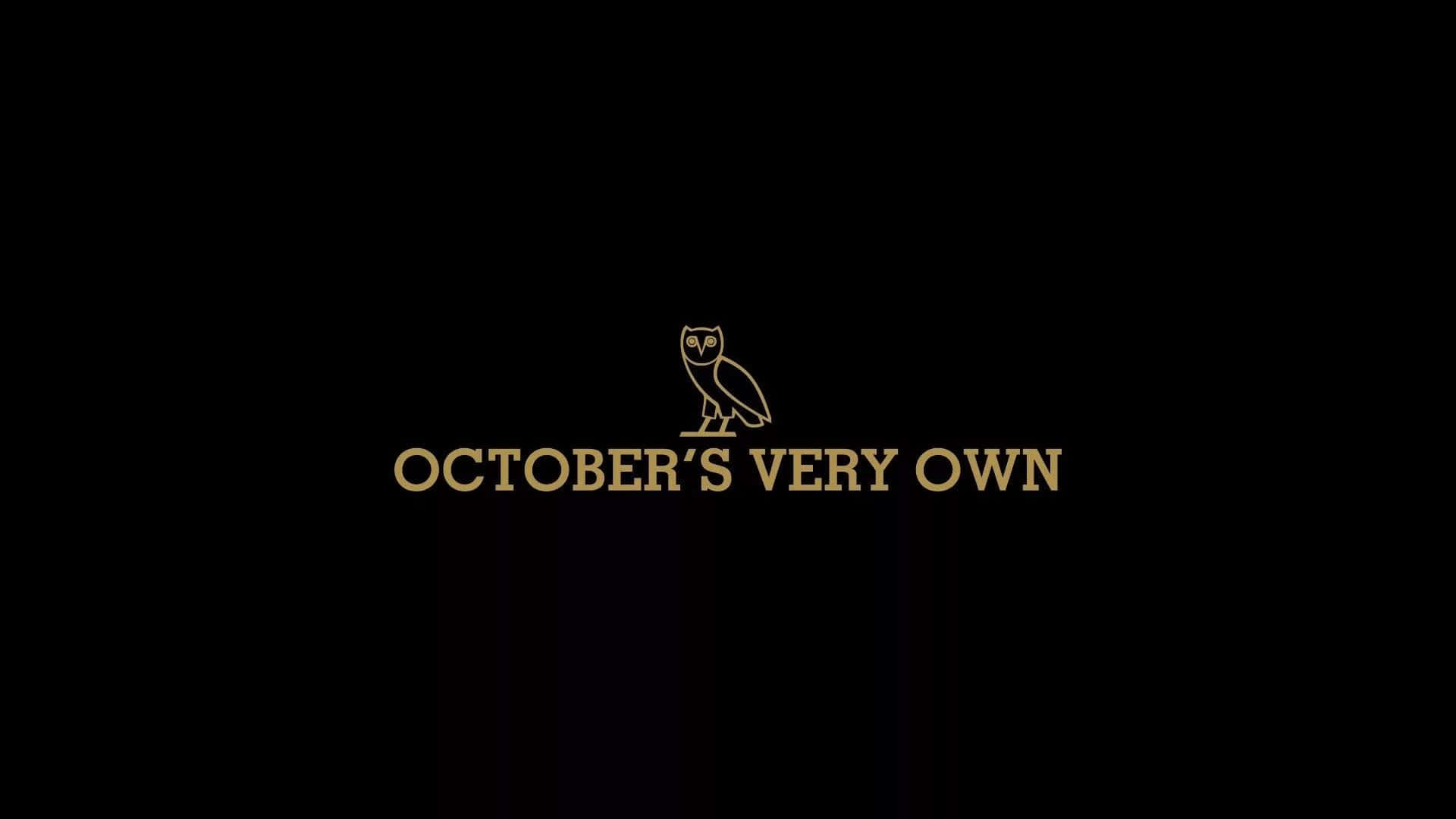 金色貓頭鷹標誌，附有 October's Very Own 文字，黑色背景。