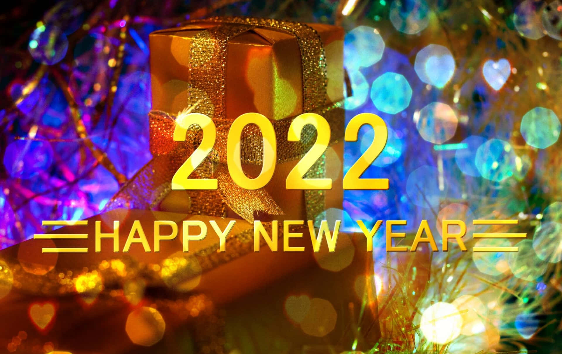 金色禮物盒，帶有 '2022 HAPPY NEW YEAR' 文字，被彩色燈光環繞。