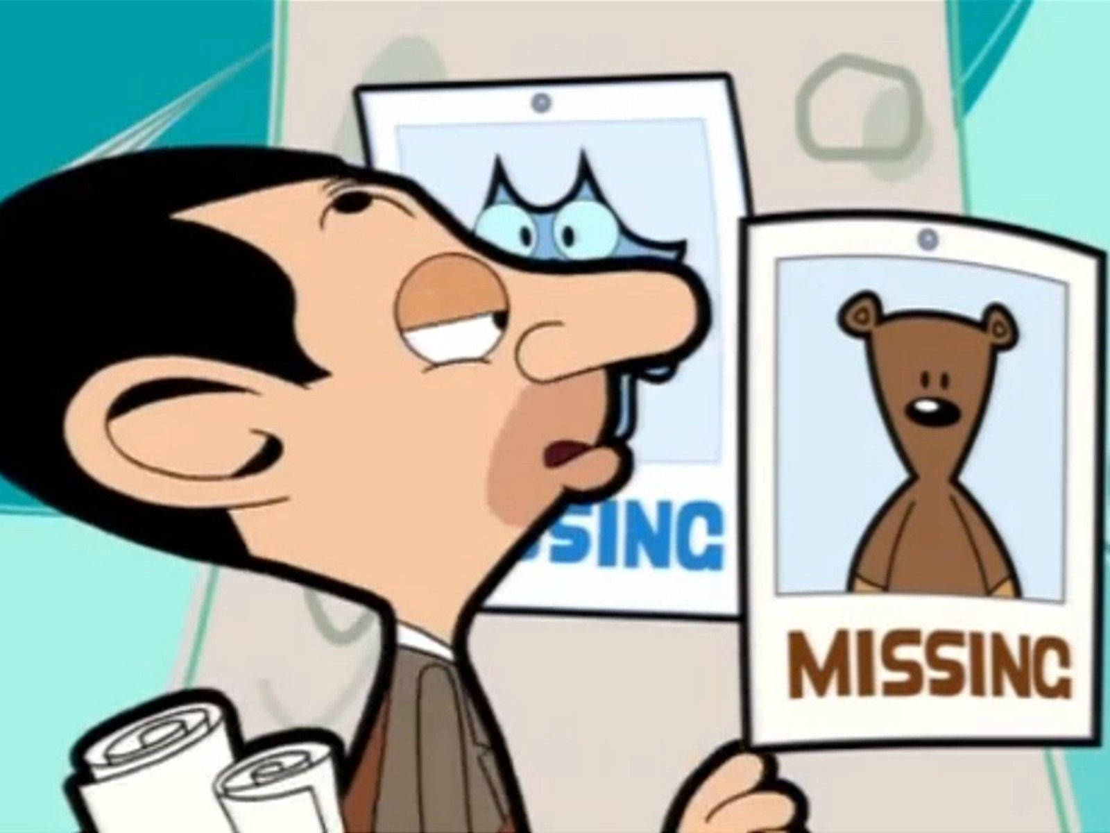 Mr Bean 拿著尋找泰迪熊和貓咪的失蹤海報。