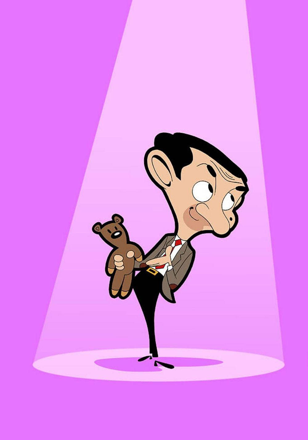 Mr Bean 喺聚光燈下抱住一隻泰迪熊，表情傻更更。