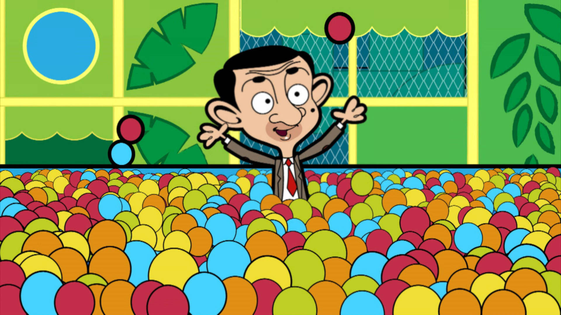 憨豆先生在球池場景 壁紙 — Mr Bean 開心咁企喺一個色彩繽紛嘅波波池入面，舉起雙手，周圍係充滿活力嘅彩色波波。