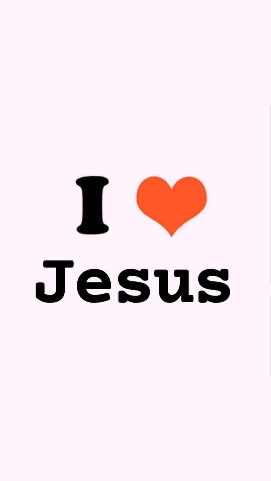文字顯示 I heart Jesus，並有一個紅色心形符號在粉紅色背景上。