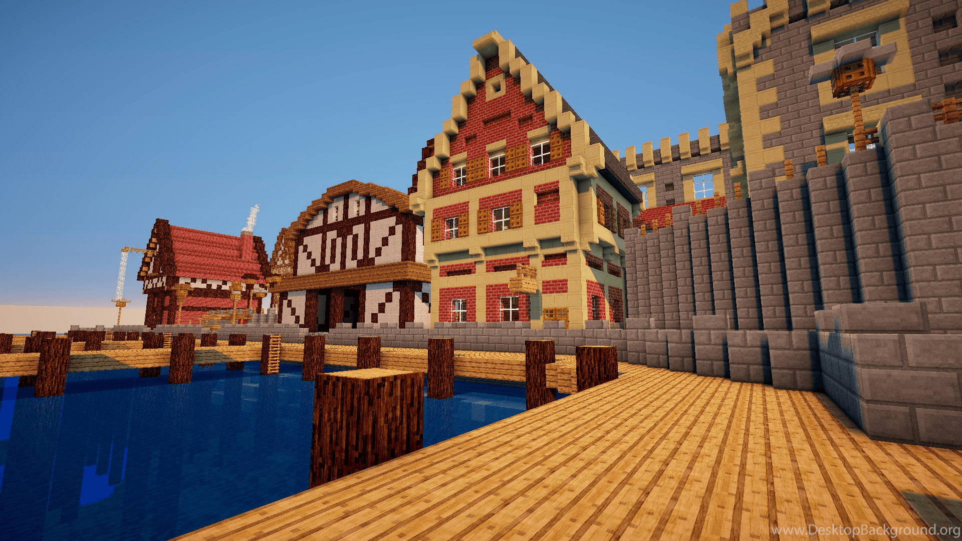 晴朗天空下，水邊有城堡和碼頭的Minecraft村莊