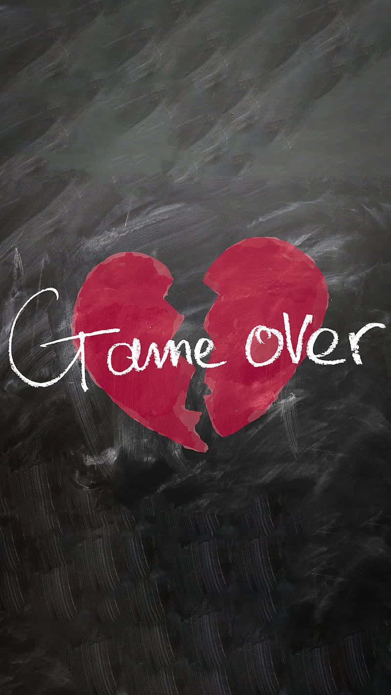 破碎的紅色心形，黑板上有game over文字。