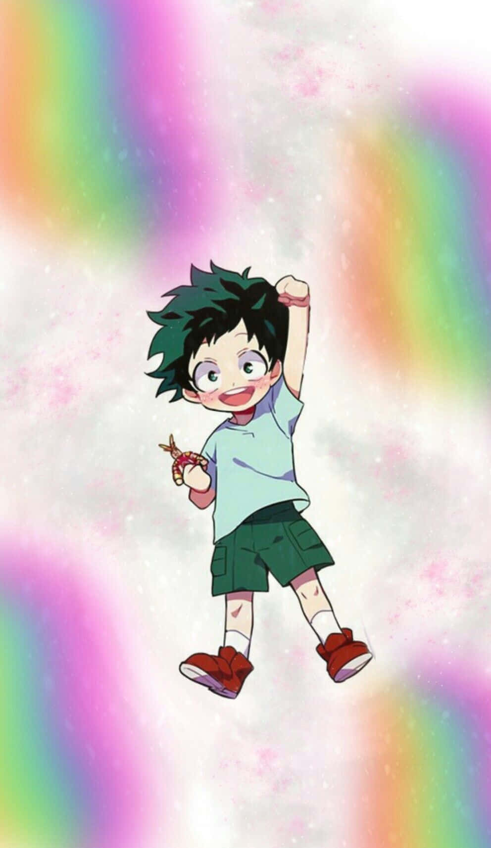 《我的英雄學院》Deku 準備迎戰 壁紙 — 一個開心的動畫男孩，綠色頭髮戴眼鏡，在鮮豔彩虹和閃爍背景中快樂漂浮。