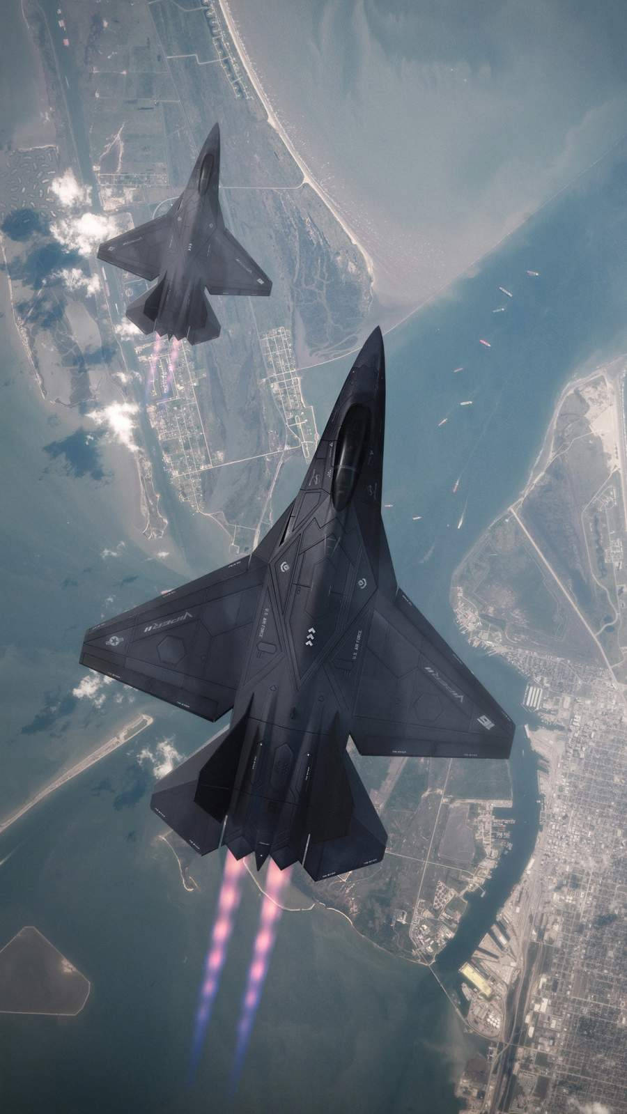 兩架戰鬥機飛越沿海城市，後燃器點亮。