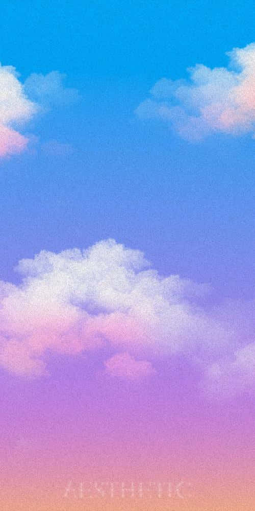 粉彩色嘅雲朵漂浮喺由藍色到粉紅色同紫色嘅漸變天空中。