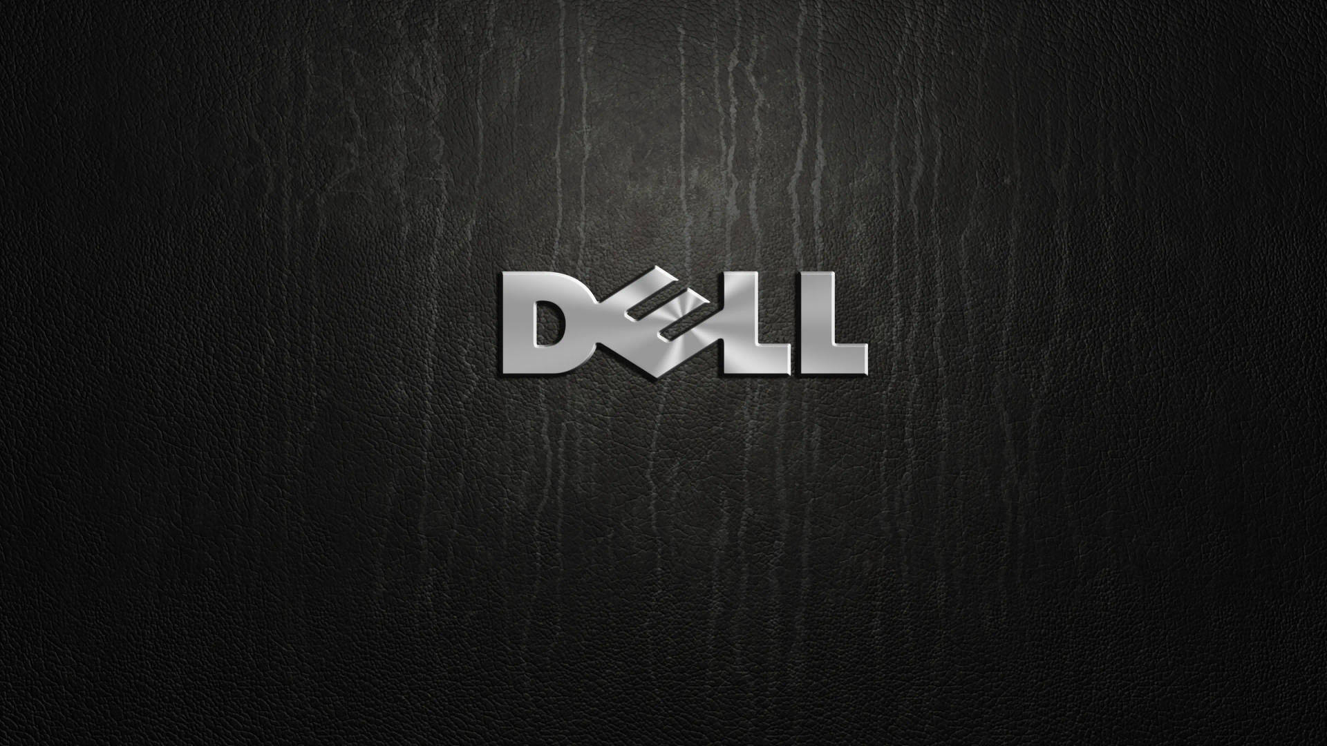 黑色皮革背景上的銀色 Dell 標誌