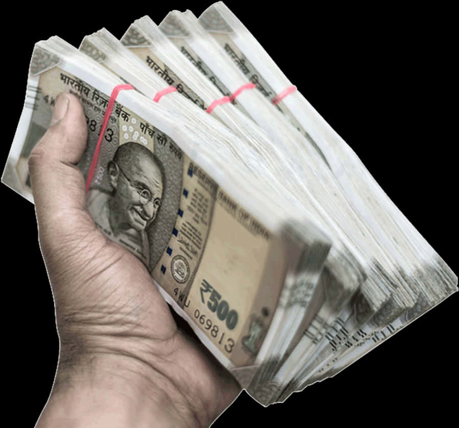 手握住印度貨幣束 壁紙