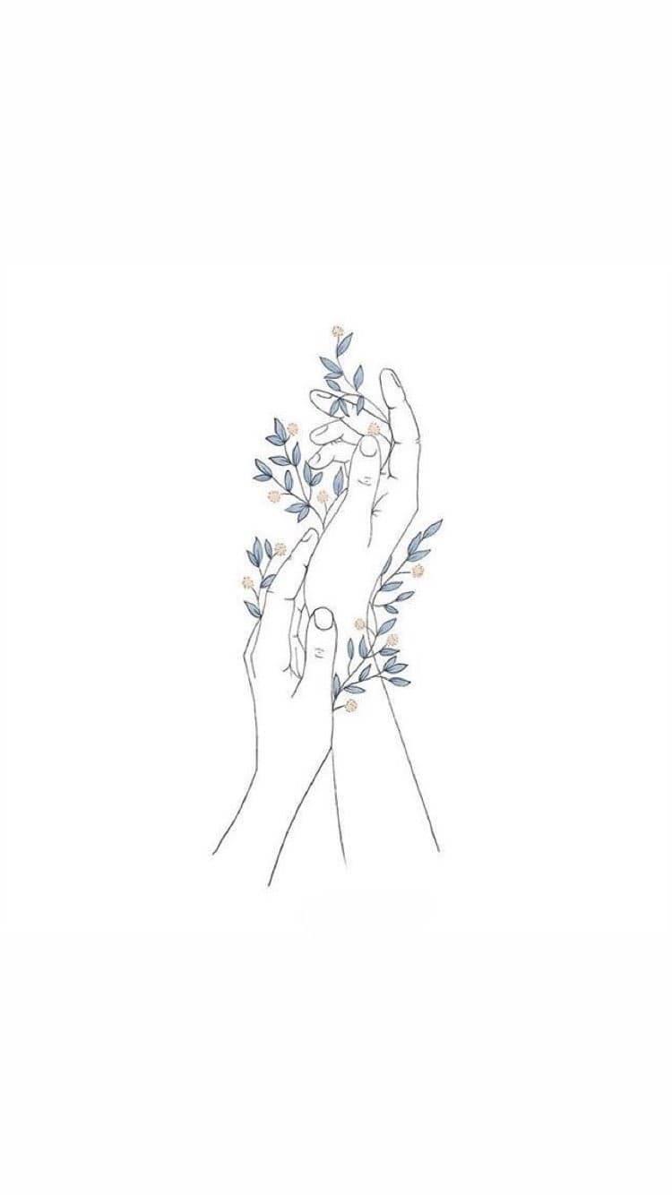 兩隻手拿著一枝帶有藍色葉子和細小花朵的小樹枝。