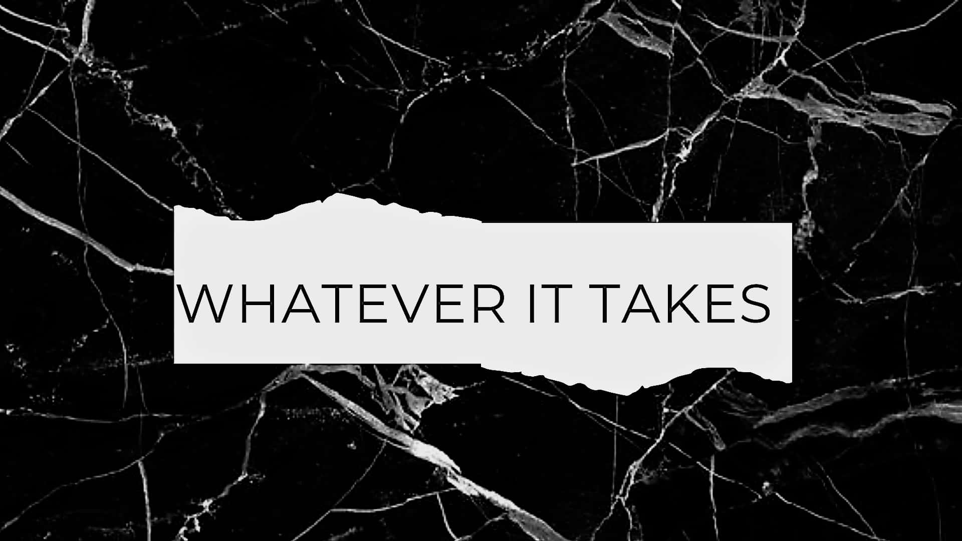 撕紙上寫著 whatever it takes，置於黑色大理石背景上