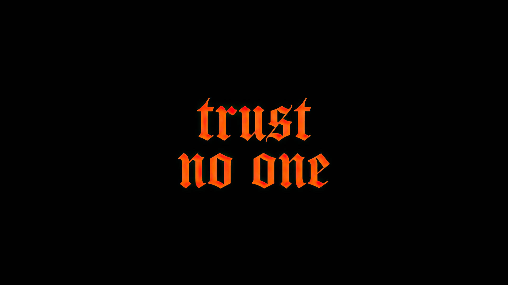 黑色背景上發光的橙色哥德式文字「trust no one」