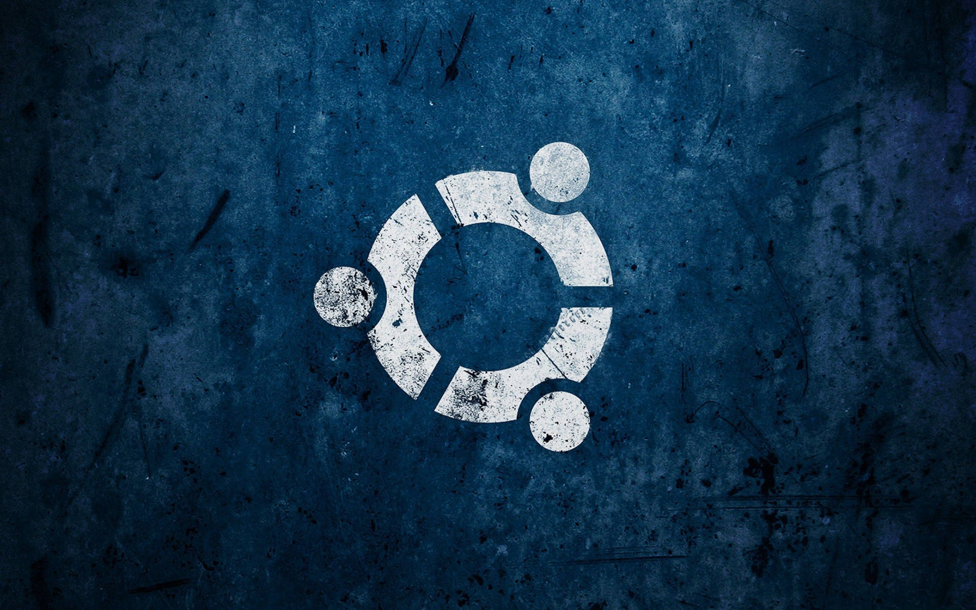 Ubuntu 標誌塗在帶有刮痕和污垢的紋理藍色牆壁上。