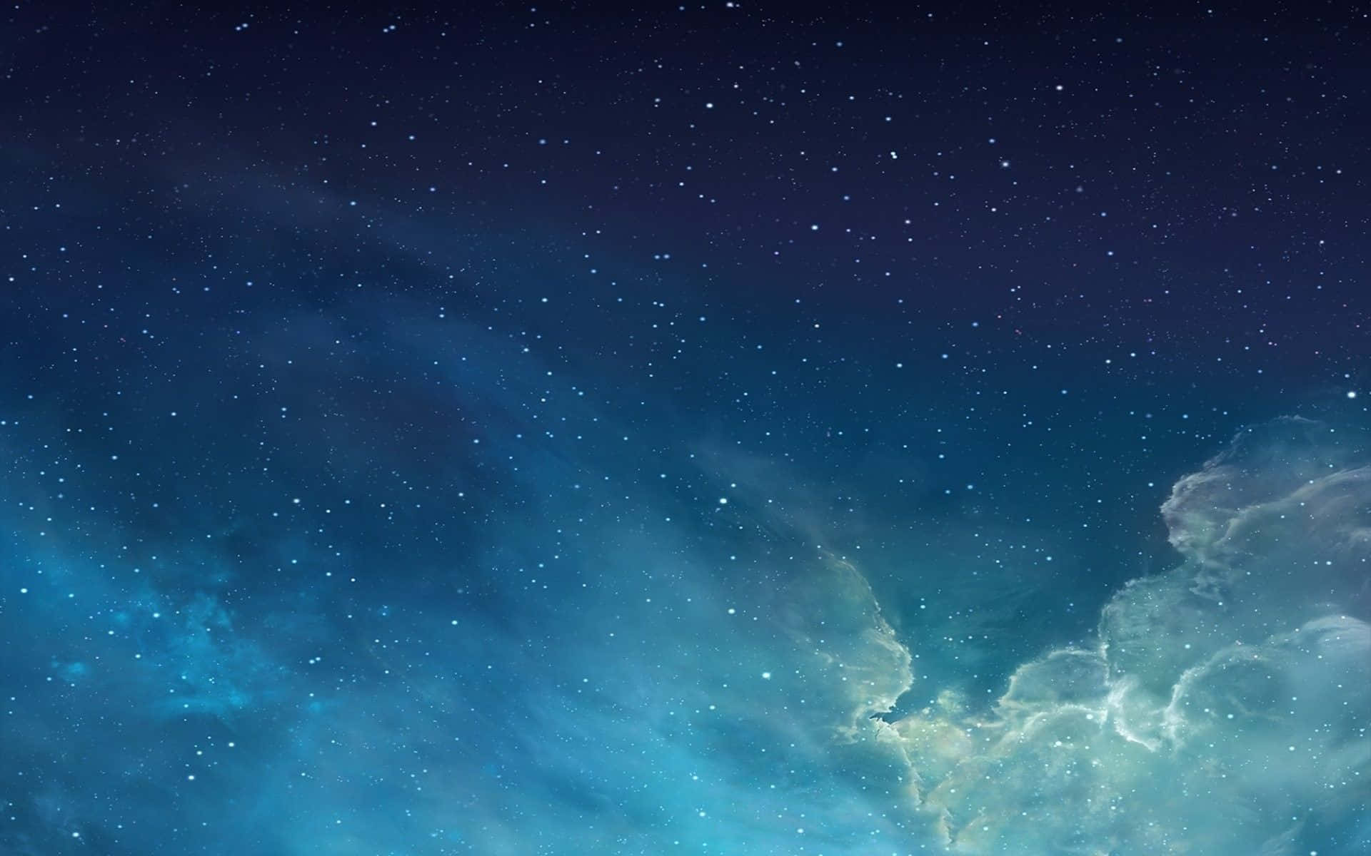 星空，帶有發光的藍色星雲雲團和散落的星星。