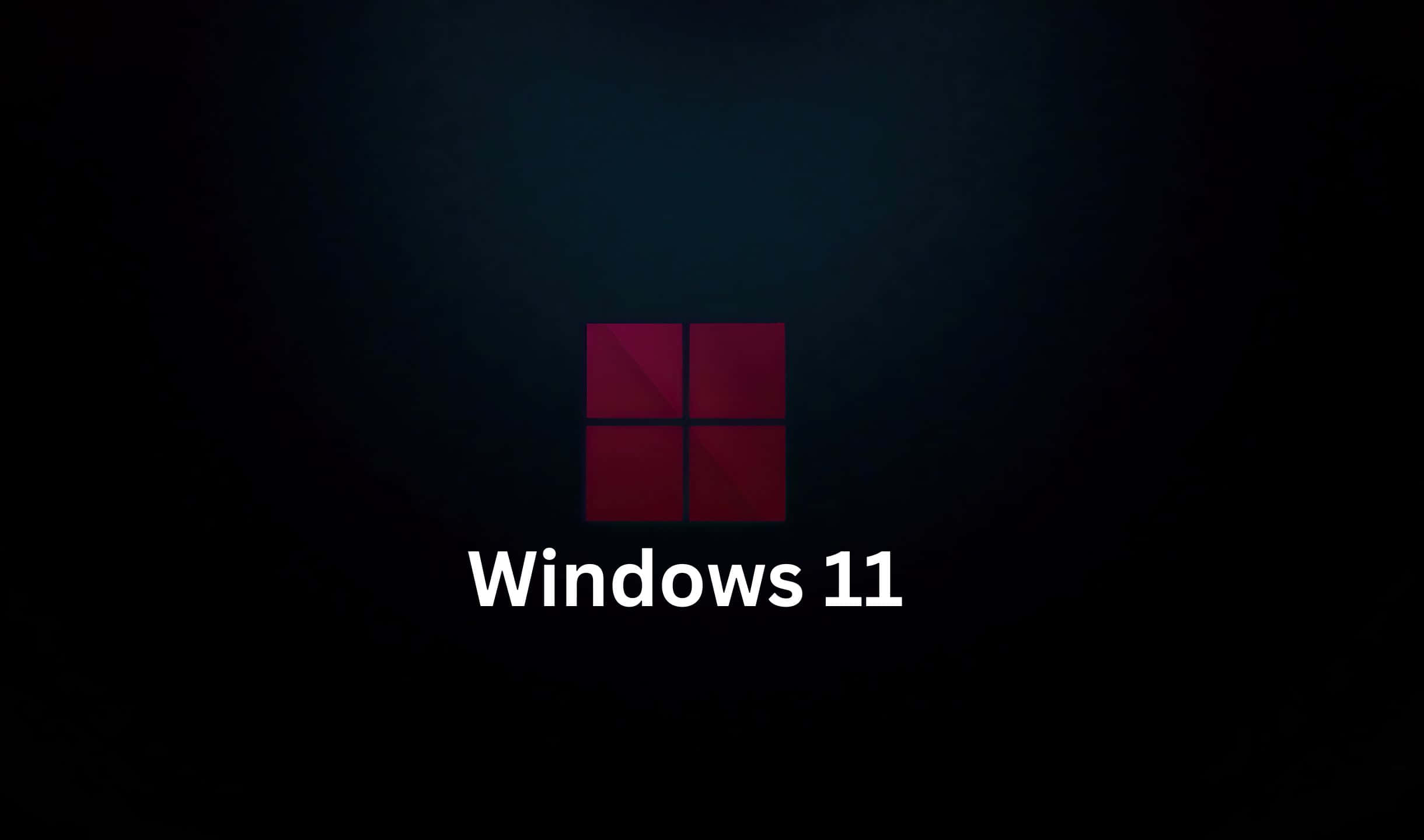 Windows 11 標誌，帶有紅色方塊和白色文字，背景為深色