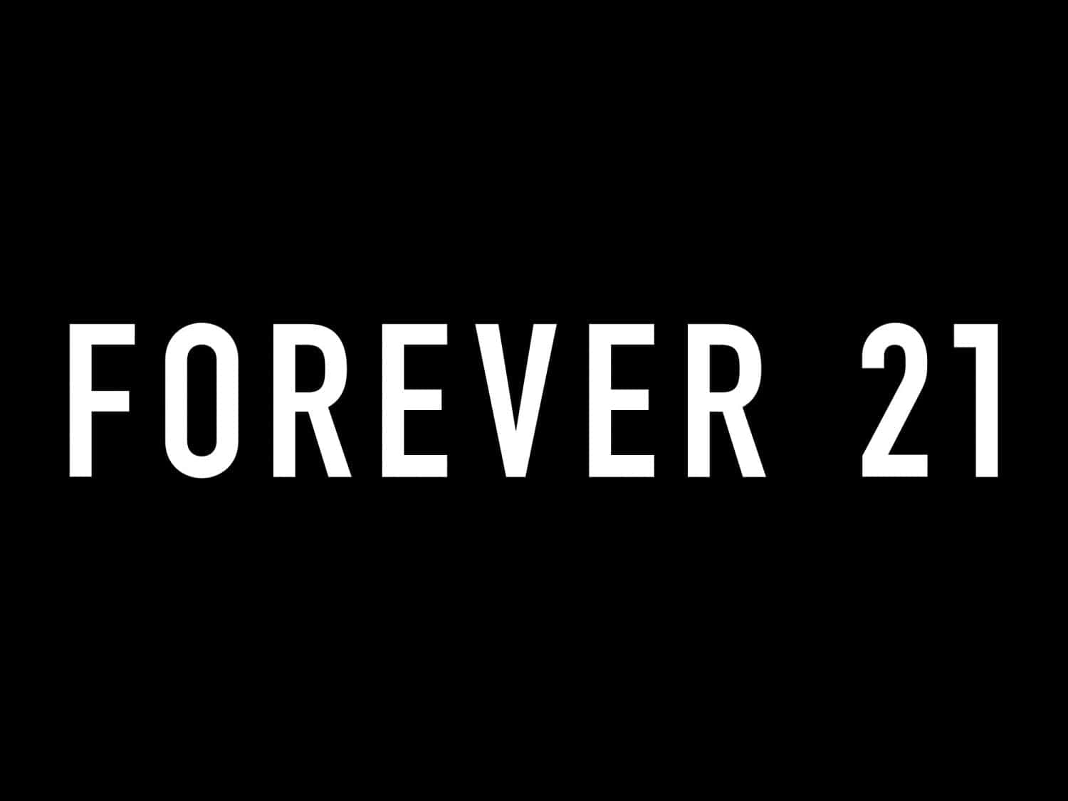 探索Forever 21最新風格與潮流 壁紙 — 粗體白色文字寫著 forever 21 居中在純黑色背景上。