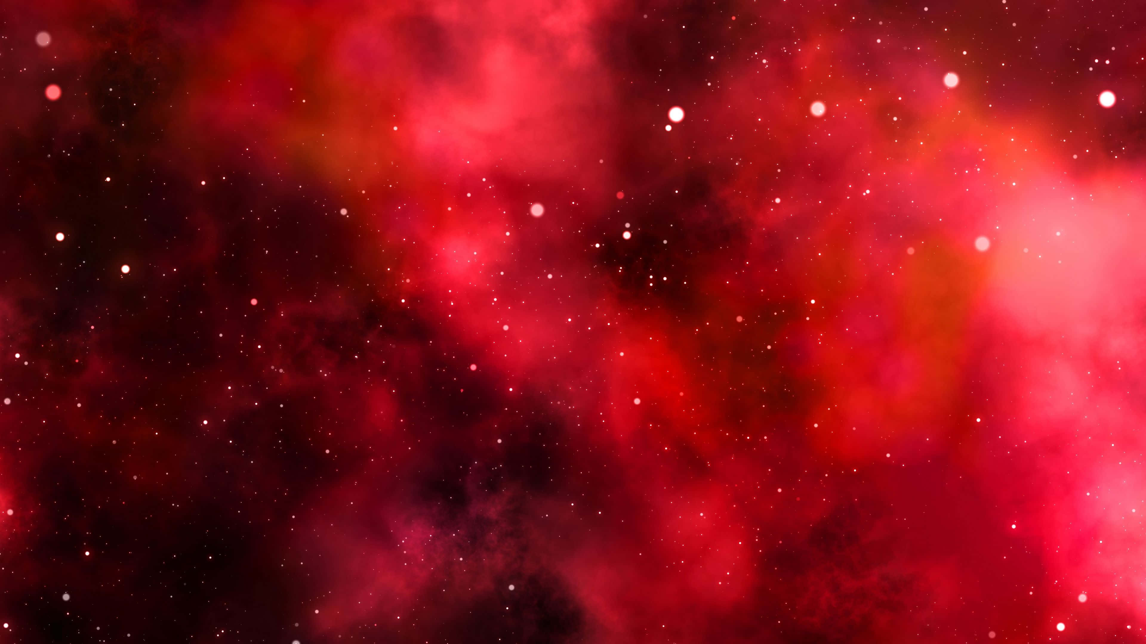探索外太空的奧秘 壁紙 — 充滿活力的紅色星雲雲層與發光的星星在宇宙虛空中旋轉。
