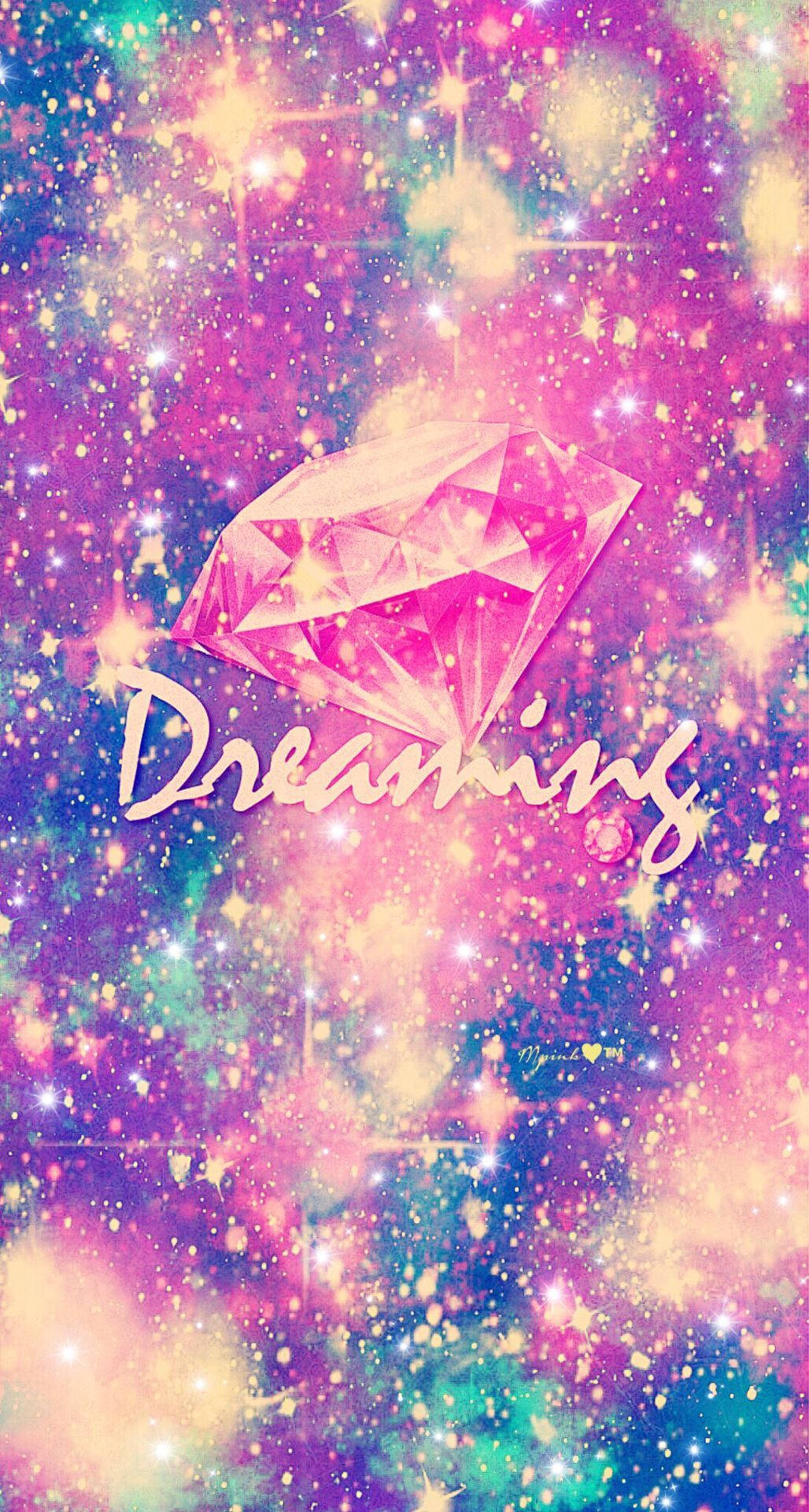 彩色星空中的粉紅色鑽石，帶有「Dreaming」字樣。