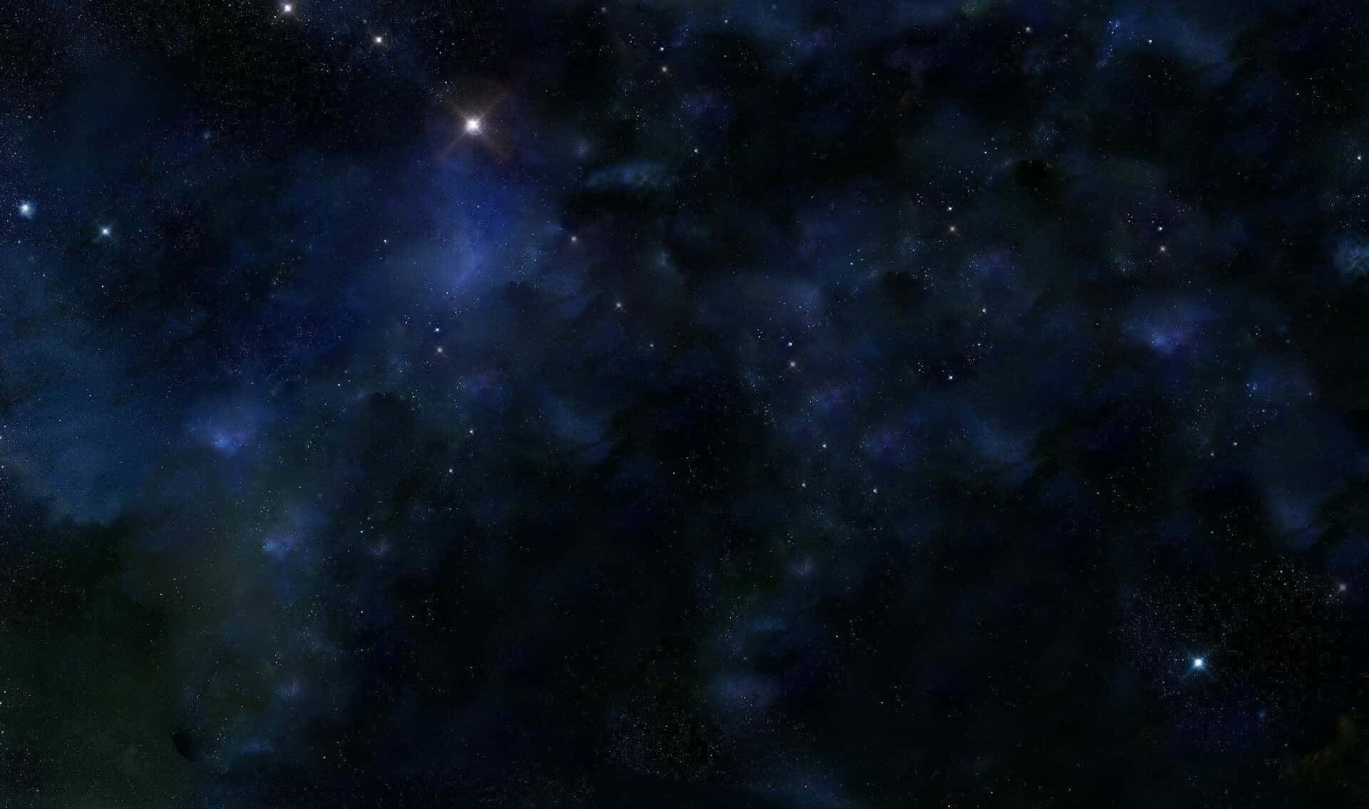 廣闊的黑暗空間，充滿發光的藍色星雲和閃爍的星星。