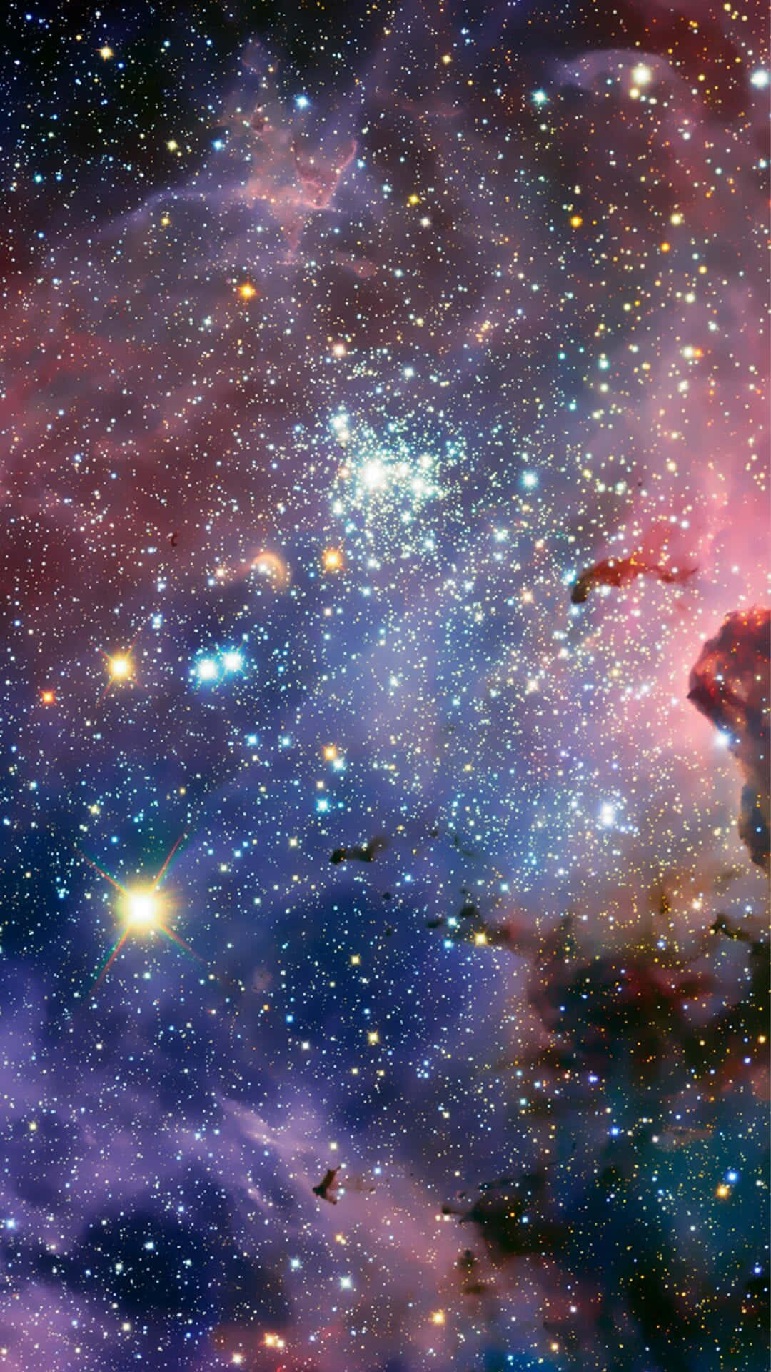 充滿發光星星和彩色氣體雲的鮮豔宇宙星雲。
