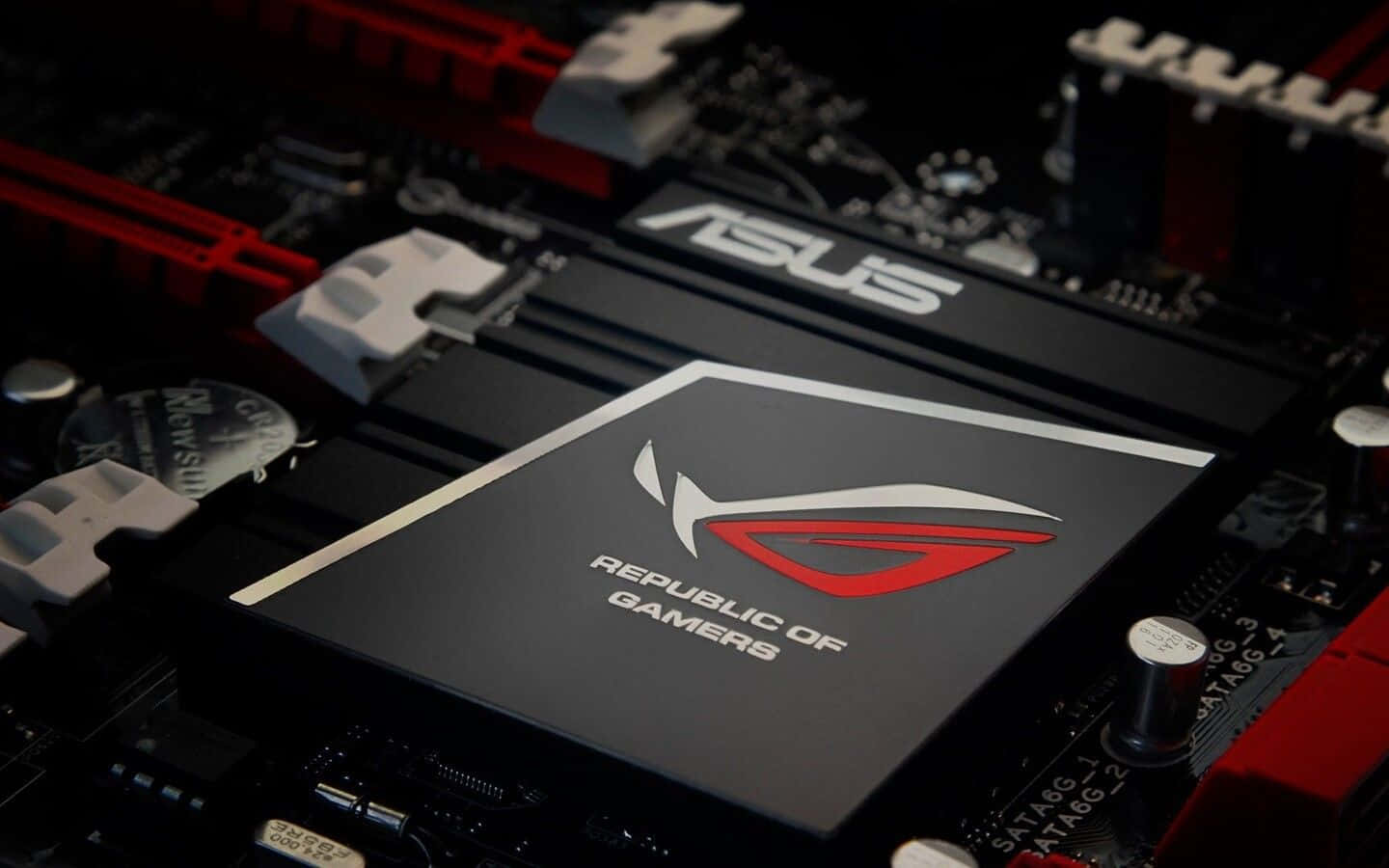 ASUS ROG 遊戲主機板，帶有紅色和黑色組件及電路。
