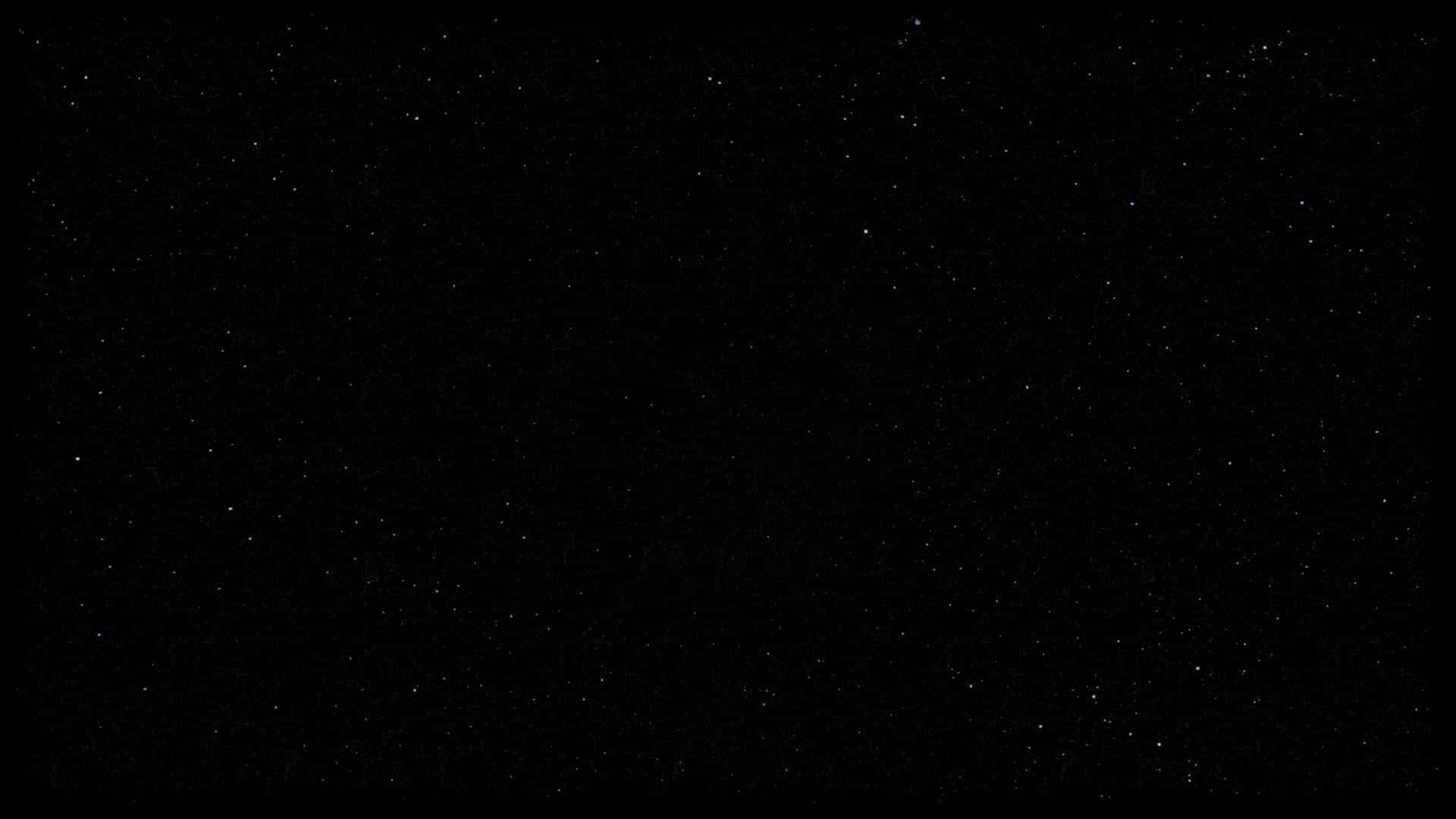 深邃的黑色虛空中，佈滿了無數遙遠星星的星空夜晚。