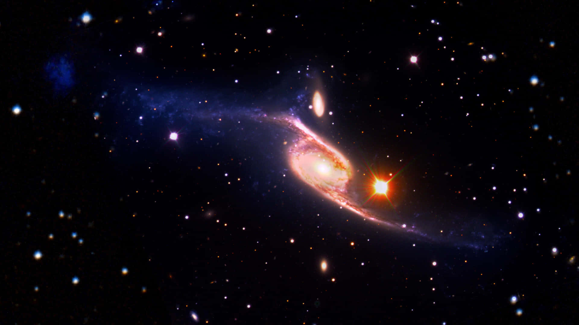 一個螺旋星系，在深空中擁有發光的旋臂和明亮的星星。