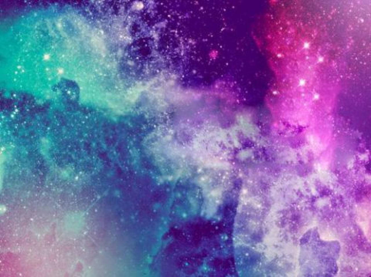 色彩繽紛的宇宙星雲，帶有旋轉的星系和閃爍的星星。